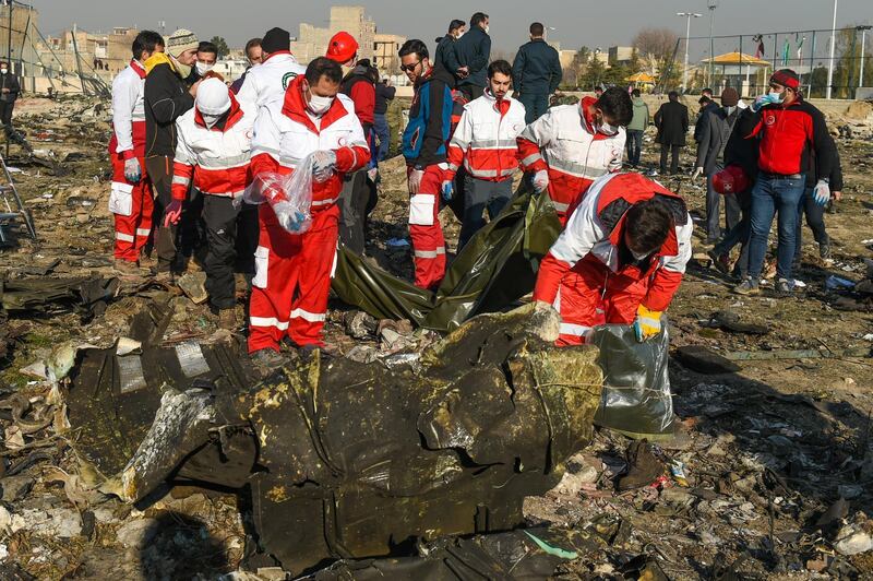 Rescue workers search the wreckage of a Boeing Co. 737-800 aircraft, operated by Ukraine International Airlines, which crashed shortly after takeoff near Shahedshahr, Iran, on Wednesday, Jan. 8, 2020. The passenger jet, Flight 752, bound for Ukraine crashed shortly after takeoff in Iran, killing everyone on board. Photographer: Ali Mohammadi/Bloomberg
