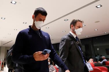 FILE PHOTO: Serbian tennis player Novak Djokovic walks in Melbourne Airport before boarding a flight, after the Federal Court upheld a government decision to cancel his visa to play in the Australian Open, in Melbourne, Australia, January 16, 2022.  REUTERS / Loren Elliott / File Photo