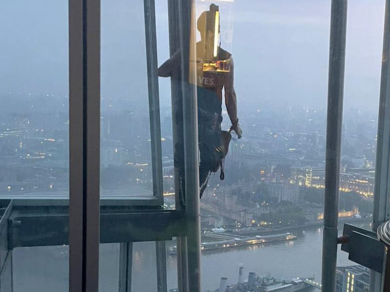 YouTuber Adam Lockwood passes the 40th floor as he climbs the 310-metre The Shard building in central London barefoot on September 4, 2022. PA