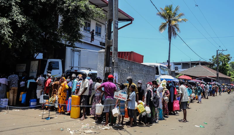 People in Colombo queue to buy fuel, which among other commodities is in short supply in Sri Lanka. EPA