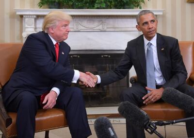 (FILES) In this file photo taken on November 10, 2016, US President Barack Obama and President-elect Donald Trump shake hands during a  transition planning meeting in the Oval Office at the White House in Washington, DC.  With the US presidential campaign heating up, the White House continues to look backward, comparing President Donald Trump's economic record to his predecessor Barack Obama.
The Trump administration released the Economic Report of the President on February 20, 2020, which in nearly every metric claims a vast improvement over the previous administration.
 / AFP / JIM WATSON
