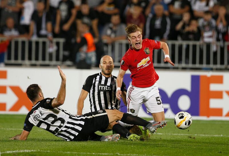 Brandon Williams is fouled by Partizan's Bojan Ostojic, left, and Zoran Tosic in Belgrade. AP