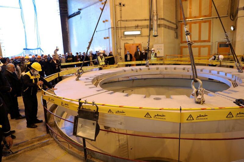 Members of the media and officials tour the water nuclear reactor at Arak in 2019. WANA via Reuters