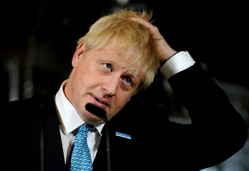 FILE - In this July 27, 2019, file photo, Britain's Prime Minister Boris Johnson reacts during a speech on domestic priorities at the Science and Industry Museum in Manchester, England. Johnson is gambling his future on the audacious proposition that he can blunt an effort to halt his Brexit plan by simply suspending Parliament for key weeks ahead of the Oct. 31 departure date. (AP Photo/Rui Vieira, File)