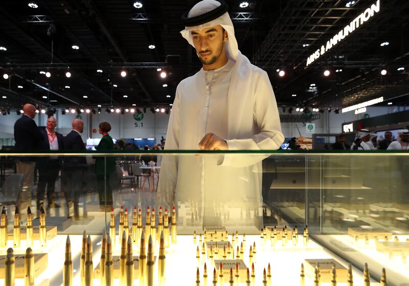 Mohamed Al Marzooqi looks at ammunition made in the UAE at the Edge stand
