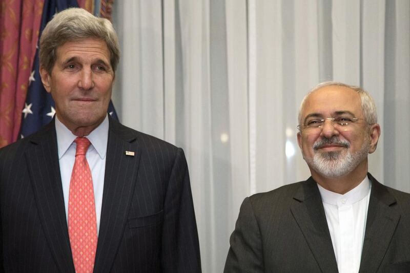 US Secretary of State John Kerry and his Iranian counterpart Mohammad Javad Zarif pose before resuming talks over Iran's nuclear programme in Lausanne. Brian Snyder / AFP Photo