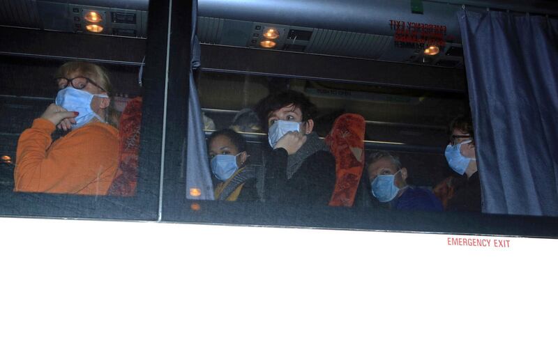 Passengers of an aircraft are being taken to Arrowe Park Hospital, where passengers that have been repatriated to the UK from a cruise ship hit by the COVID-19 coronavirus in Yokohama, Japan, will be quarantined for 14 days to protect against the spread of the illness should any of them be infected, in Upton, England. AP