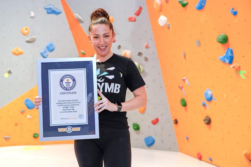 Abu Dhabi, United Arab Emirates, August 20, 2020.  Bianca Sammut, Acting Head of Yas Theme Parks proudly displays the Guinness World Records Certificate.  Cymb Abu Dhabi is celebrating being recognised with two Guinness World Records for the largest indoor skydiving wind tunnel and the world’s tallest indoor climbing wall.
Victor Besa /The National
Section:  NA
Reporter:  Jason Von Berg