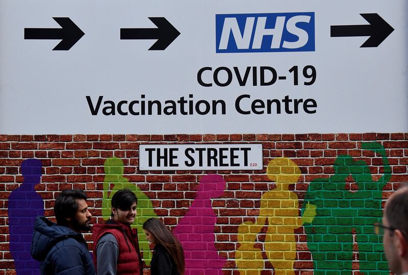 The sign to a Covid-19 vaccination centre in London. Reuters