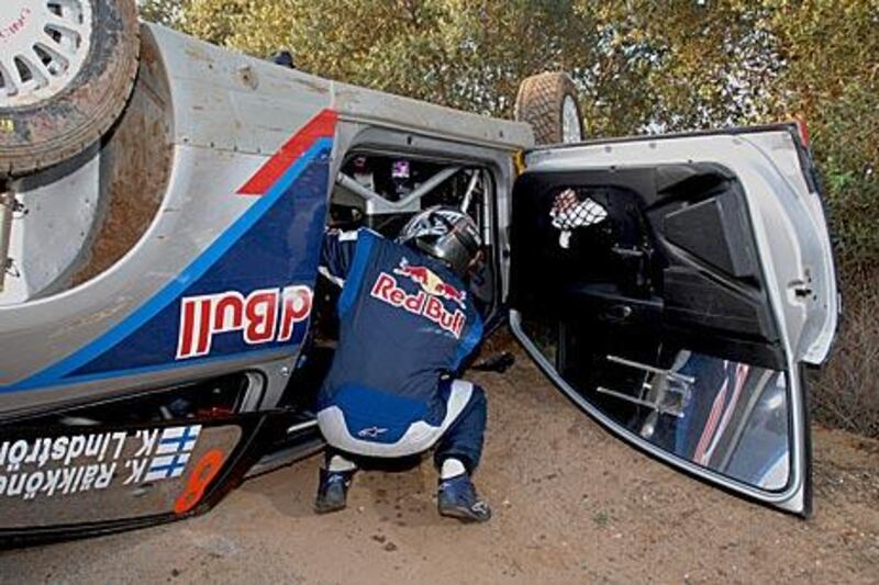 Kimi Raikkonen inspects his car after crashing during yesterday’s shakedown for Rally Spain. So much damage was inflicted to the vehicle that the Finnish driver will not be able to compete in the event, which starts today.