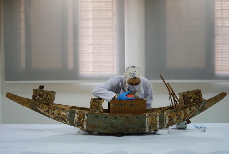 An Egyptian archaeological technician works at the National Museum of Egyptian Civilization in Cairo, Egypt. Reuters