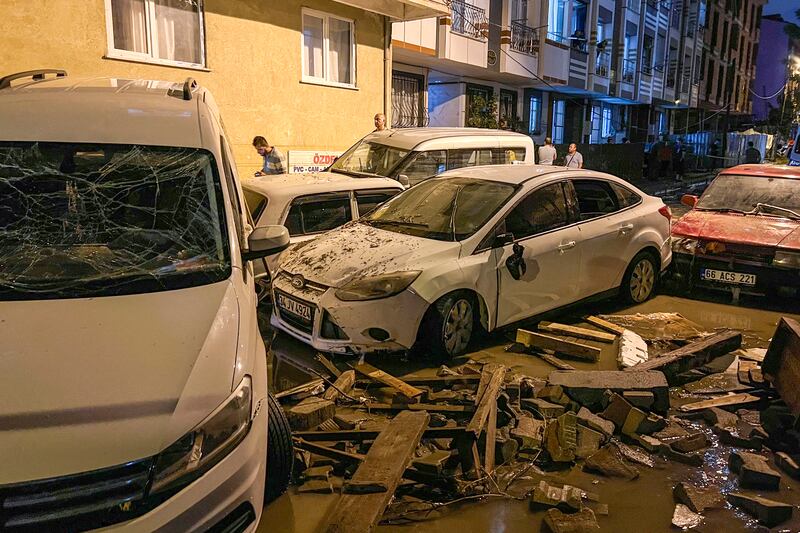 Vehicles are scattered during floods after heavy rains in Istanbul, Turkey, early Wednesday, Sept.  6, 2023.  AP