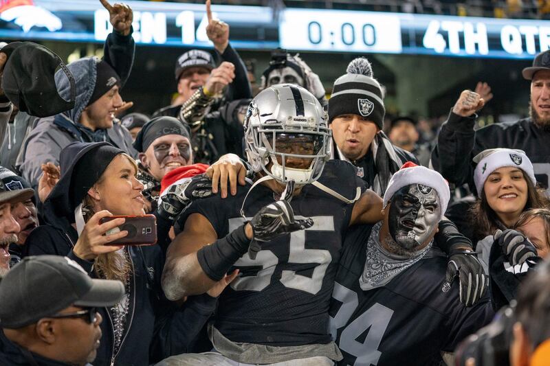 December 24, 2018; Oakland, CA, USA; Oakland Raiders middle linebacker Marquel Lee (55) jumps into the Black Hole after the game against the Denver Broncos at Oakland Coliseum. Mandatory Credit: Kyle Terada-USA TODAY Sports