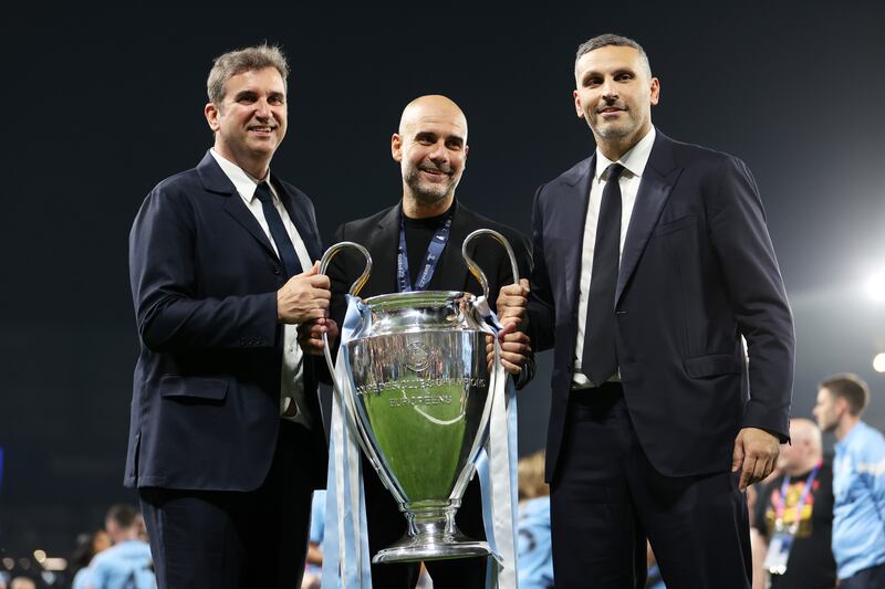 Ferran Soriano, Manager of Manchester City, Pep Guardiola, Manager of Manchester City, and Khaldoon Al Mubarak, Chairman of Manchester City, celebrates with the UEFA Champions League trophy. Getty Images