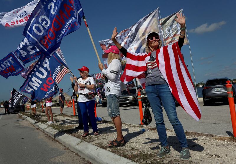 Supporters of former US president Donald Trump line up as they gather near his Mar-a-Lago resort and home in Palm Beach, Florida, on Tuesday. Getty 