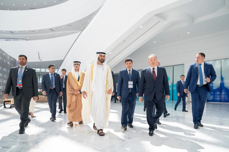 ASTANA, KAZAKHSTAN - July 05, 2018: HH Sheikh Mohamed bin Zayed Al Nahyan, Crown Prince of Abu Dhabi and Deputy Supreme Commander of the UAE Armed Forces (4th R) and HE Nursultan Nazarbayev, President of Kazakhstan (2nd R) attend the opening ceremony of Astana International Financial Centre. Seen with HH Sheikh Mansour bin Zayed Al Nahyan, UAE Deputy Prime Minister and Minister of Presidential Affairs (5th R).

( Hamad Al Kaabi / Crown Prince Court - Abu Dhabi )
