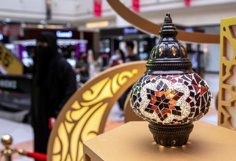 Abu Dhabi, United Arab Emirates, April 17, 2021.   Al Wahda Mall Ramadan decor.  Mall goers enjoy the Ramadan lanters exhibition at the main lobby of the mall.
Victor Besa/The National
Section:  NA/Stand Alone/Stock Images