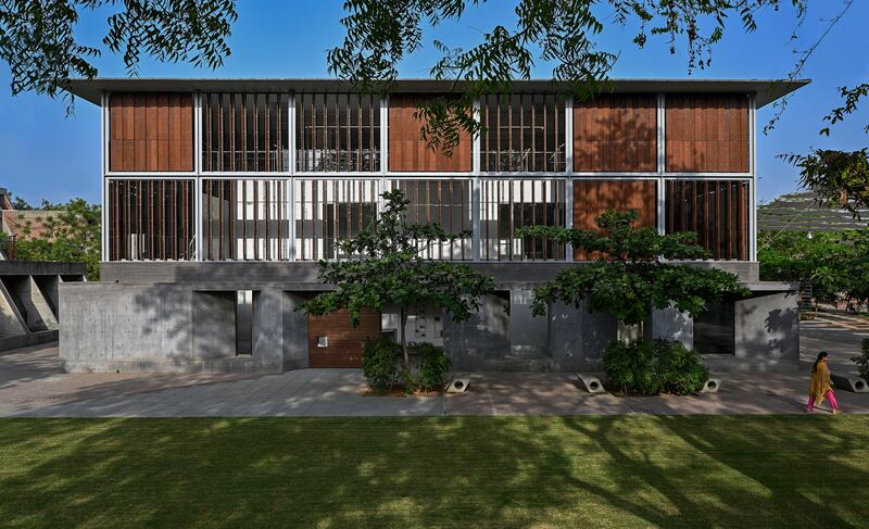 Lilavati Lalbhai Library at CEPT University, in Ahmedabad, India. The library, a living case study of passive climate mitigation strategies, integrates seamlessly into the existing campus while forging its own distinct identity.