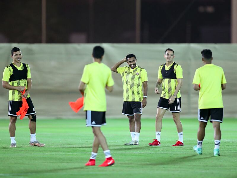 UAE players Tahnoon Al Zaabi, middle, Caio Canedo, second right, and Fabio De Lima during training for the World Cup qualifying match against Iran. Chris Whiteoak / The National