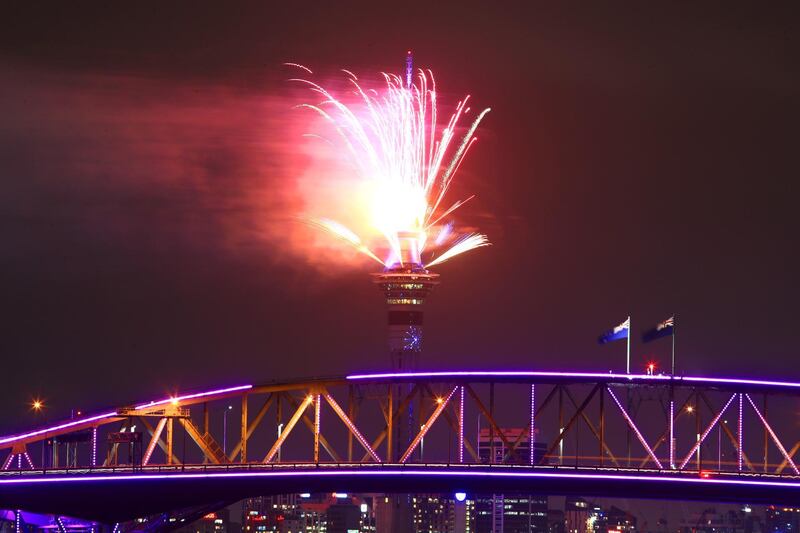 Fireworks are seen exploding from the Sky Tower with the Auckland Harbour Bridge in the foreground during the Auckland New Year's Eve celebrations in New Zealand. Getty Images