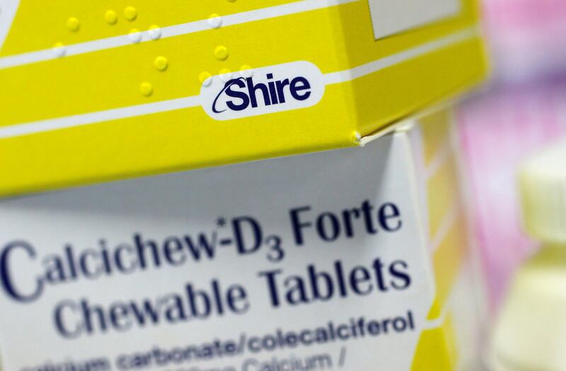 FILE PHOTO: Vitamins made by Shire are displayed at a chemist's in northwest London, Britain, July 11, 2014.  REUTERS/Suzanne Plunkett/File Photo