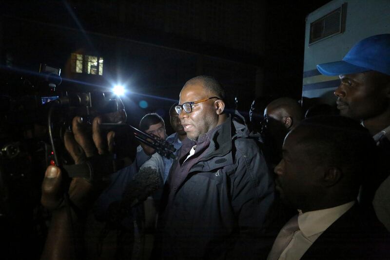 Zimbabwean opposition official TendaI Biti leaves the magistrates courts after been granted bail in Harare, Thursday, Aug, 9, 2018. Biti was charged with inciting public violence and declaring unofficial results as fears grow about a government crackdown following the disputed July 30 election, raising concerns about a wave of repression against the opposition by the government of Zimbabwe's President Emmerson Mnangagwa. (AP Photo/Tsvangirayi Mukwazhi)