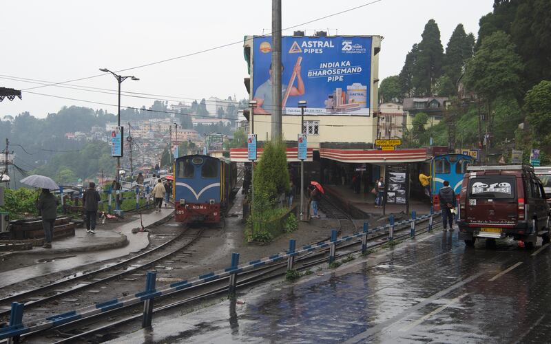 Darjeeling Himalayan Railway lines running next to a road