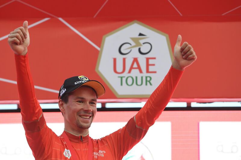 Slovenian Primoz Roglic of team Jumbo-Visma celebrates on the podium the red jersey at the end of the fifth stage of the UAE tour in Khor Fakkan on February 28, 2019.   / AFP / GIUSEPPE CACACE
