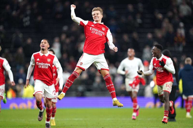 Arsenal's Martin Odegaard celebrates in front of the away fans following victory. PA