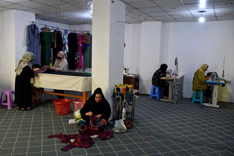Women working in a tailor's shop at a market in Mazar-i-Sharif, northern Afghanistan, ahead of Eid al-Adha. AFP