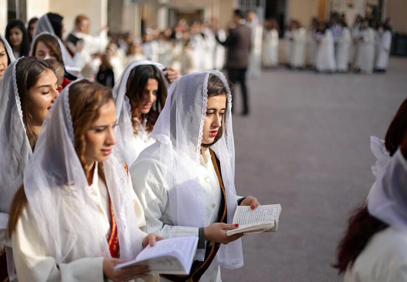 Syriac Christian women pray during a mass celebration of Christmas at the Saint Efram Syriac Orthodox Church in Qamishly, Syria. REUTERS/Rodi Said