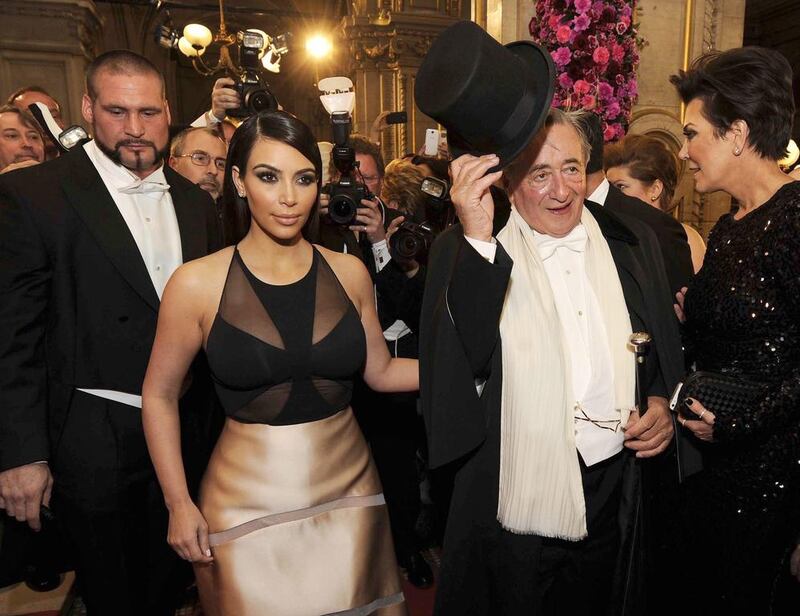 US television personality Kim Kardashian (left), her mother Kris Jenner (right) and their host Austrian businessman Richard Lugner (centre) arrive for the Vienna Opera Ball.