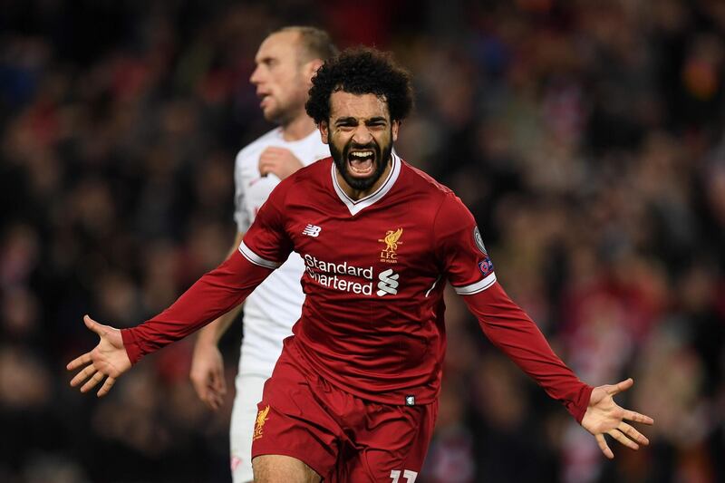(FILES) This file photograph taken on December 6, 2017, shows Liverpool's Egyptian midfielder Mohamed Salah celebrating after scoring their seventh goal during the UEFA Champions League Group E football match between Liverpool and Spartak Moscow at Anfield in Liverpool, north-west England. 
Liverpool star Mohamed Salah won the African Player of the Year award on January 4, 2018, the first Egyptian to achieve the feat since 1983. Fellow Liverpool attacker Sadio Mane of Senegal was runner-up and 2015 winner Pierre-Emerick Aubameyang of Borussia Dortmund and Gabon third
 / AFP PHOTO / Paul ELLIS