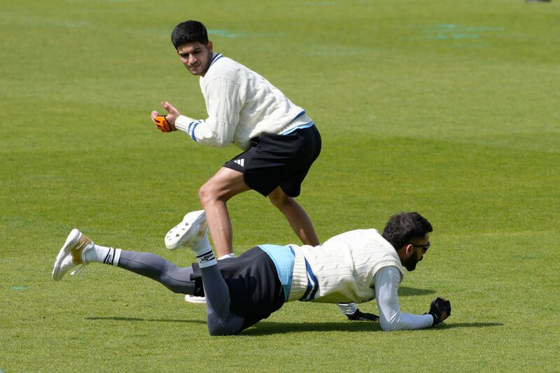 India's Virat Kohli catches a ball during training. AP