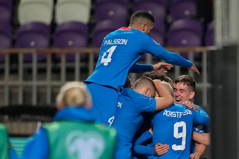 Albert Gudmundsson celebrates with his teammates after scoring Iceland's third goal. AP