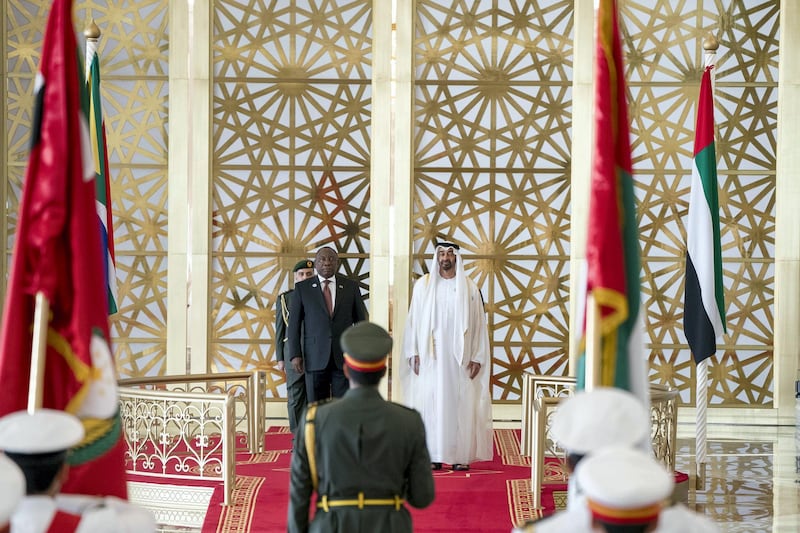 ABU DHABI, UNITED ARAB EMIRATES - July 13, 2018: HH Sheikh Mohamed bin Zayed Al Nahyan Crown Prince of Abu Dhabi Deputy Supreme Commander of the UAE Armed Forces (R) and HE Cyril Ramaphosa, President of South Africa (L), stand for the UAE national anthem during a reception at the Presidential Airport.

( Rashed Al Mansoori / Crown Prince Court - Abu Dhabi )
---