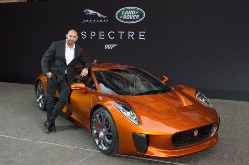 Actor Dave Bautista poses in front of the 2015 Jaguar C-X75, which will be on sale in Abu Dhabi this November. Twitter / Dave Bautista