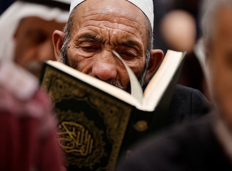 A worshipper reads the Quran
