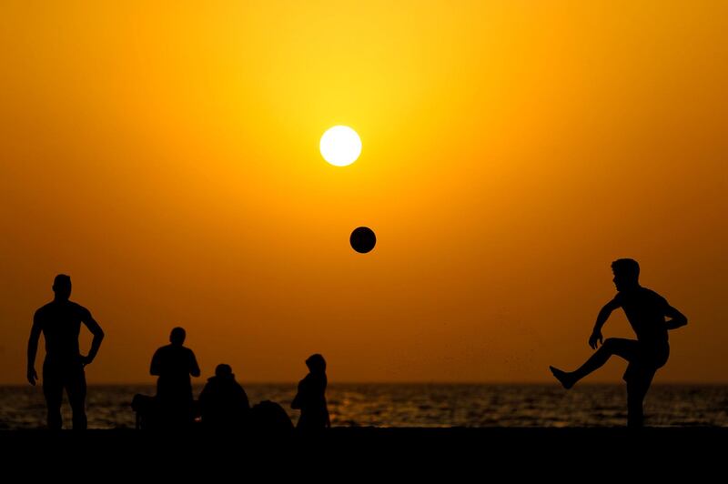 Visitors to Kite beach play Footvolley at sunset in Dubai on June 8th, 2021. Chris Whiteoak / The National. 
Reporter: N/A for News