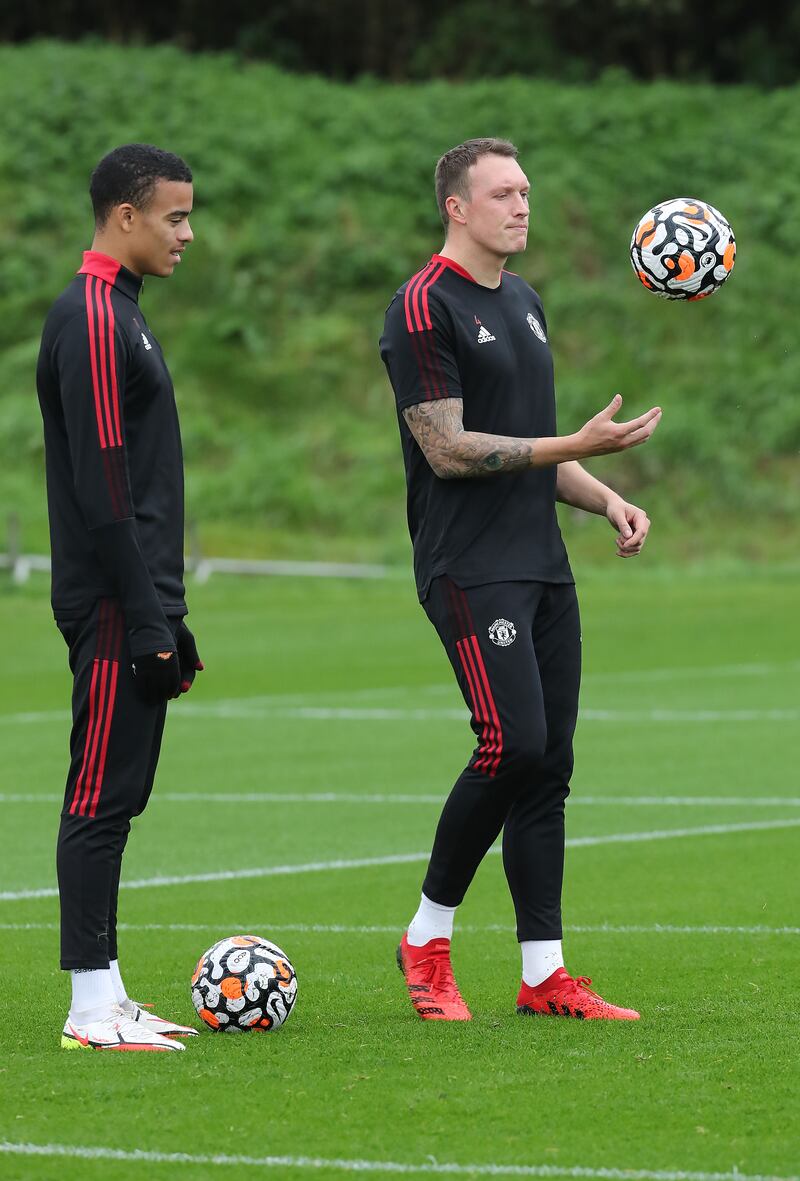 Mason Greenwood and Phil Jones in action.
