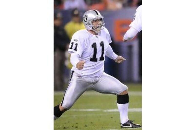 Sebastian Janikowski celebrates landing his 63-yard field goal for the Oakland Raiders.