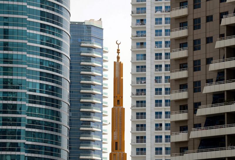 Dubai, United Arab Emirates - Reporter: N/A. News. A minaret stands tall among the skyscrappers in Barsha Heights. Sunday, April 18th, 2021. Dubai. Chris Whiteoak / The National