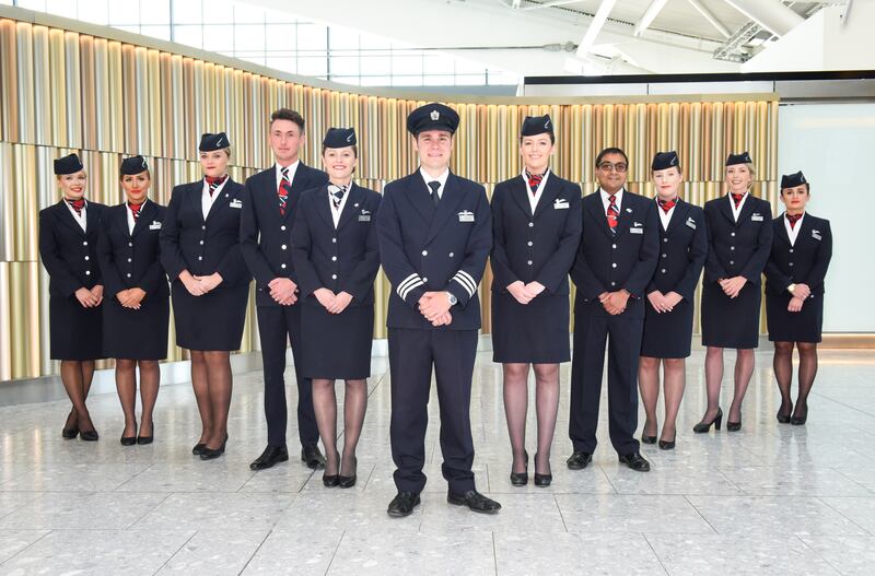British Airways cabin crew pose in their uniforms in 2018. Getty Images