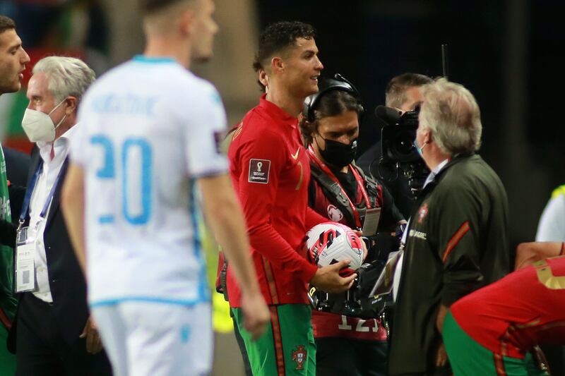 Portugal's Cristiano Ronaldo leaves the field with the match ball after scoring a hat-trick. AP Photo