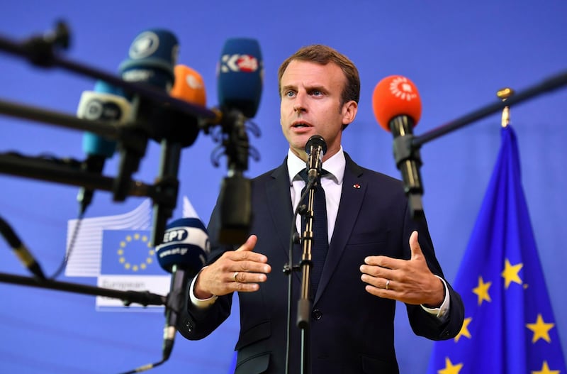 FILE - In this Sunday, June 24, 2018 file photo French President Emmanuel Macron speaks with the media at the conclusion of an informal EU summit on migration at EU headquarters in Brussels. (AP Photo/Geert Vanden Wijngaert, File)