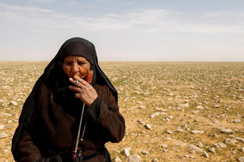 Truffle hunter Zahra Buheir, 72, smokes a cigarette. "Here it is, the truffle, a blessing from God!" she said. "Rain came, and then thunder, bringing truffles up to the surface." Reuters