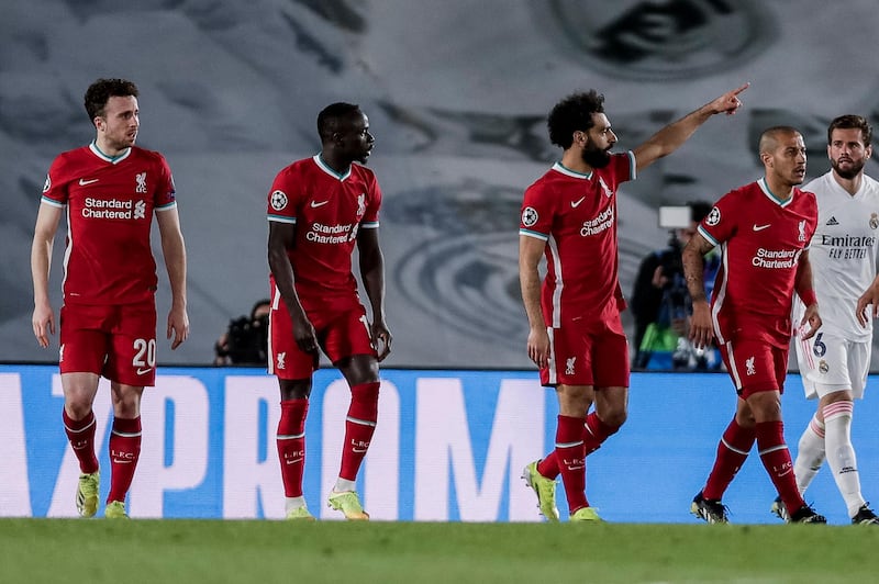 Liverpool's Mohamed Salah, second right,  after scoring his team's crucial away goal. AP