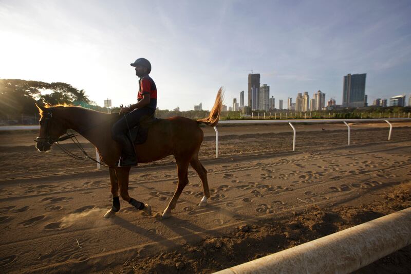 A man rides a horse at Mahalaxmi Race course in Mumbai, India on May 28, 2013
(Photo by Kuni Takahashi)