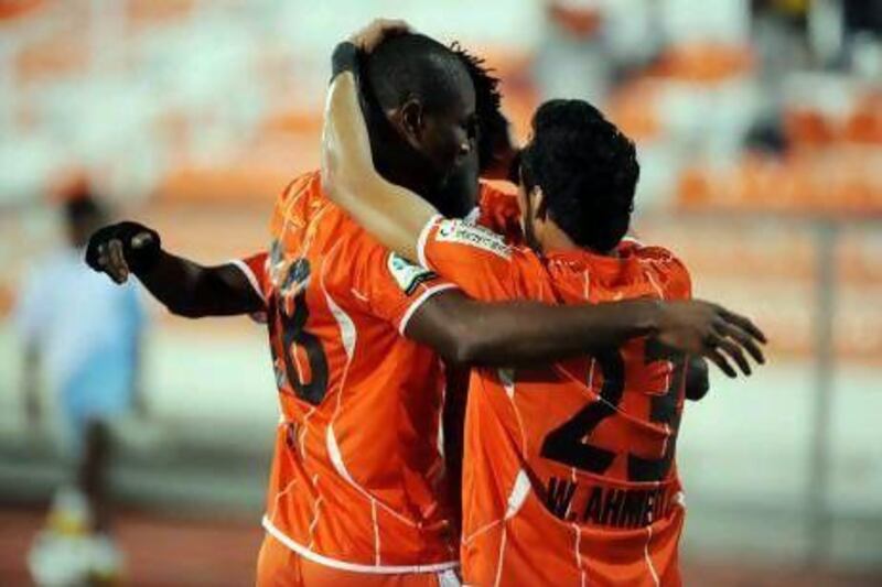 Ajman players celebrate after taking the lead against Al Shaab in the Pro League
