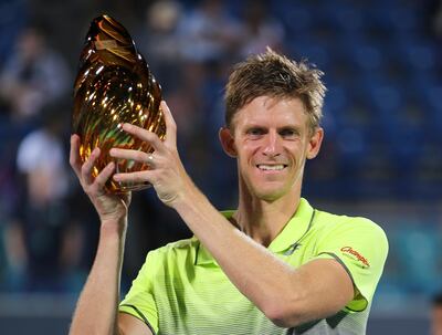 South Africa's Kevin Anderson holds the trophy after he beats Spain's Roberto Bautista Agut at the final match of the Mubadala World Tennis Championship in Abu Dhabi, United Arab Emirates, Saturday, Dec. 30, 2017. (AP Photo/Kamran Jebreili)